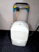 A folding sack barrow together with a dehumidifier by Ebac