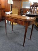 A 19th century mahogany turnover top tea table