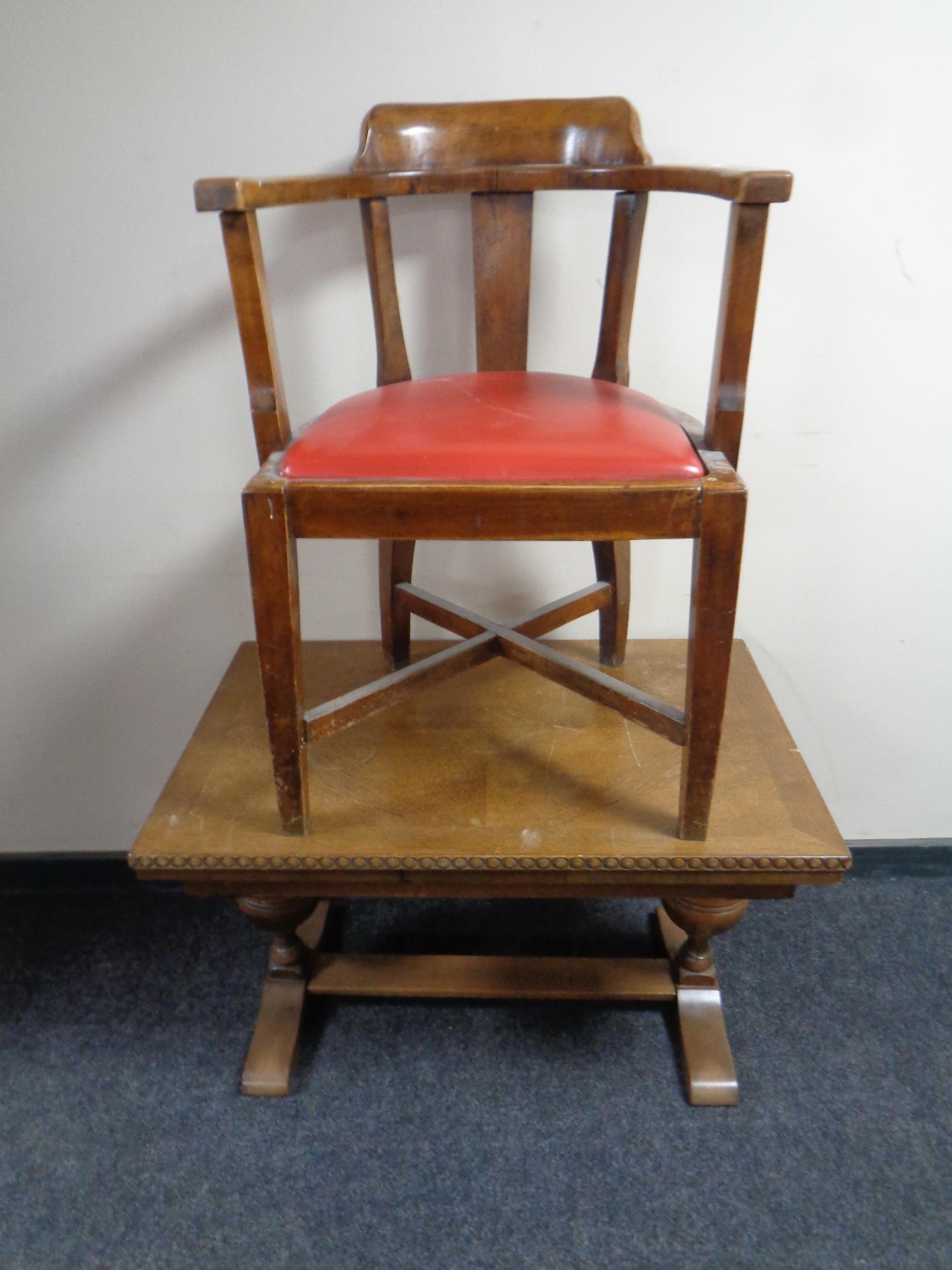 A continental oak extending refectory coffee table together with a beechwood armchair