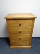 A contemporary oak four drawer chest