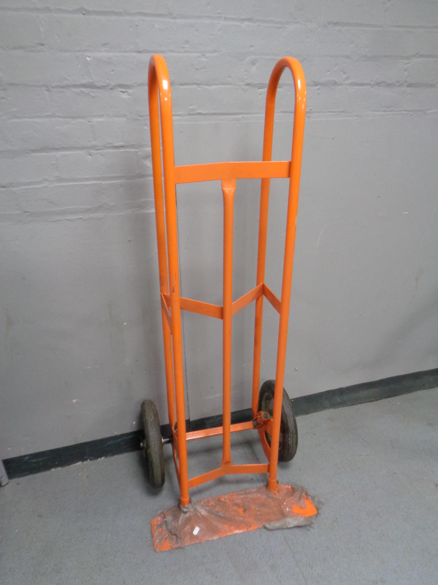 A heavy duty twin handled sack barrow with spring axle (short scoop)