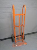 A heavy duty twin handled sack barrow with spring axle (short scoop)