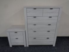 A contemporary six drawer chest together with matching two drawer bedside chest