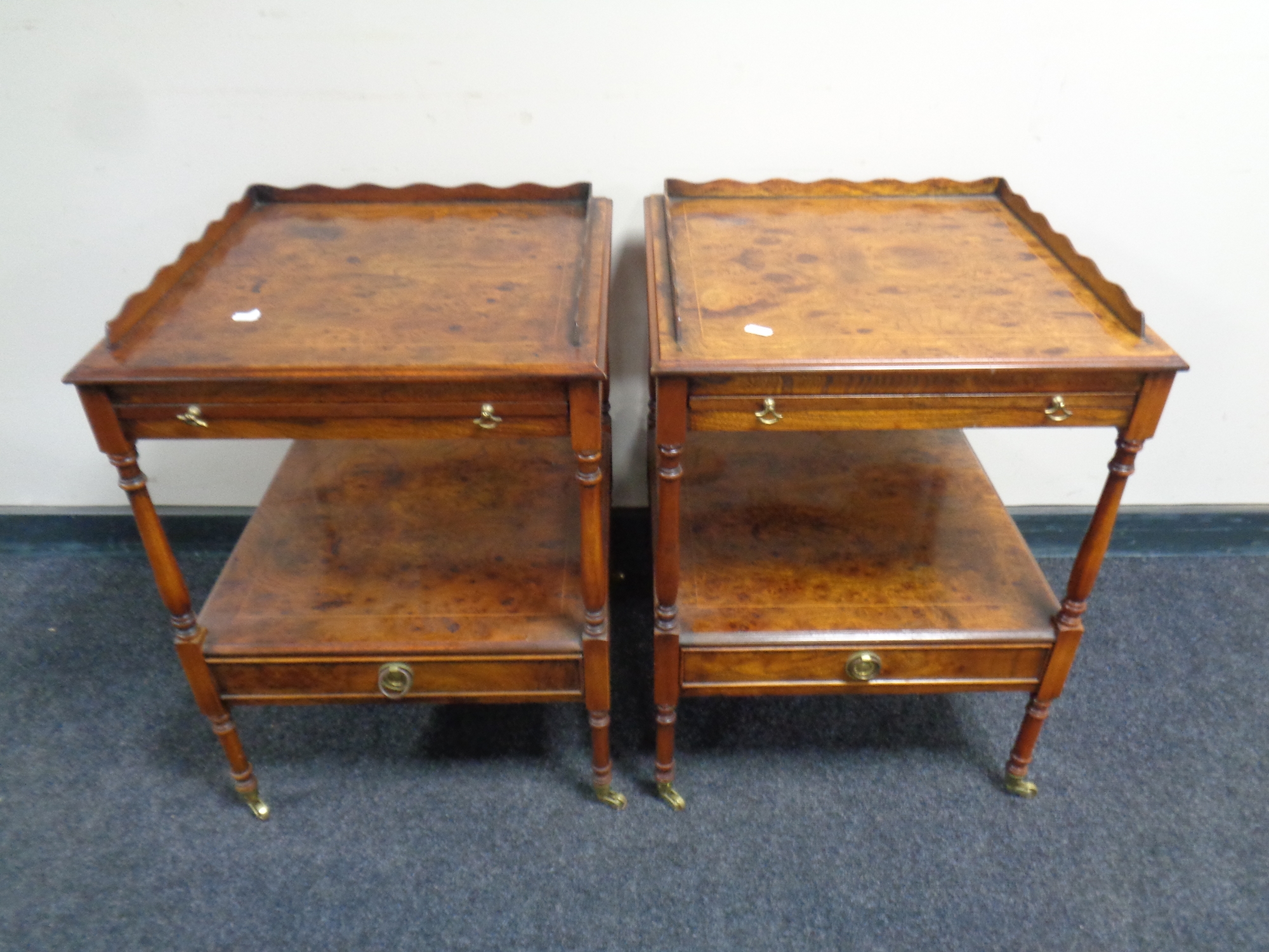 A pair of reproduction burr elm two tier occasional tables,