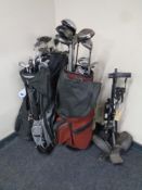 Four gold bags containing a large quantity of assorted drivers, irons and putters,