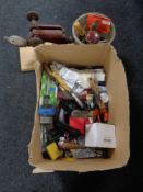 A box and a bucket containing vintage hand tools, bungee cords, hardware,