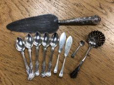 A quantity of silver cutlery including straining spoon, set of five teaspoons etc.