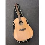 A Lorenzo Flame Series acoustic guitar in soft carry case