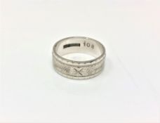 An 18ct white gold band ring, 6.2g, size M.