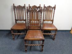 A set of four carved Edwardian oak barley twist dining chairs