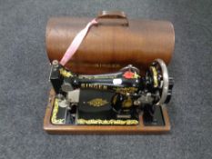 A cased 20th century Singer hand sewing machine