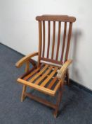 A teak garden armchair