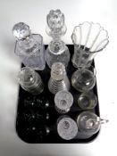 A tray containing antique and later glassware to include assorted decanters, champagne flutes,