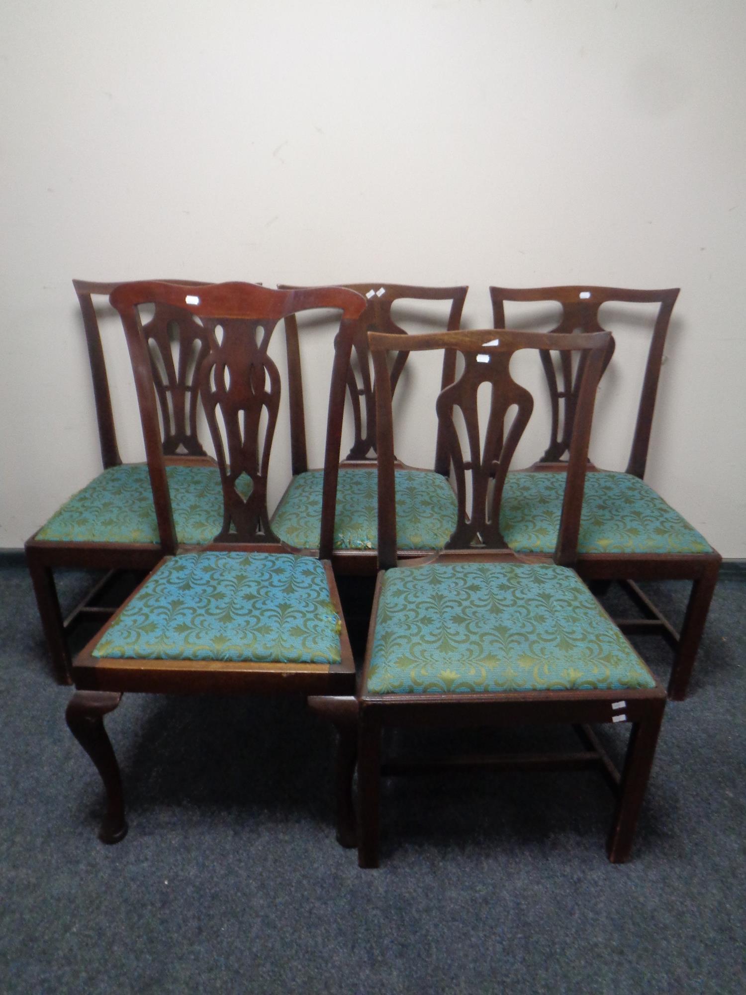 A set of four antique Chippendale style dining chairs together with one other similar chair