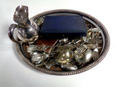 A silver plated oval serving tray together with a large quantity of loose plated cutlery,