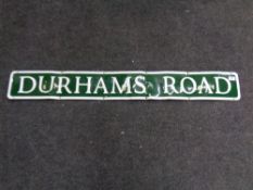 A road sign - Durhams Road, width 122 cm.
