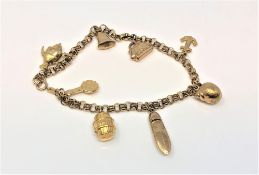 A 9ct gold charm bracelet, 8.8g.