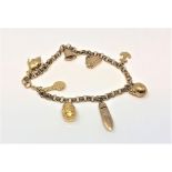 A 9ct gold charm bracelet, 8.8g.