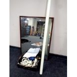 A mahogany framed wall mirror, box of curtain pole and curtain rings,