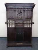 An early 20th century continental heavily carved beech hall stand