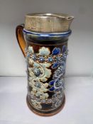 A 19th century Royal Doulton Lambeth ware jug with silver rim,