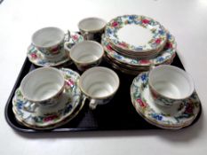 A tray containing a 24 piece Booths Flora Dora bone china tea service