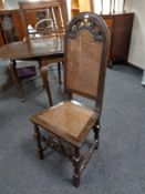 A 19th century carved oak and bergere hall chair