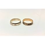 A 9ct gold textured band ring, 1.8g, together with a silver band ring.