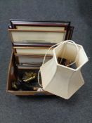 A box of antique brass wall lamp, porcelain table lamp with shade, assorted framed pictures,