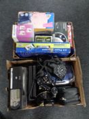 Two boxes containing assorted electricals to include an MP3 record player with speakers,