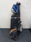 A Taylor Made Durango golf bag, a set of Wilson irons,