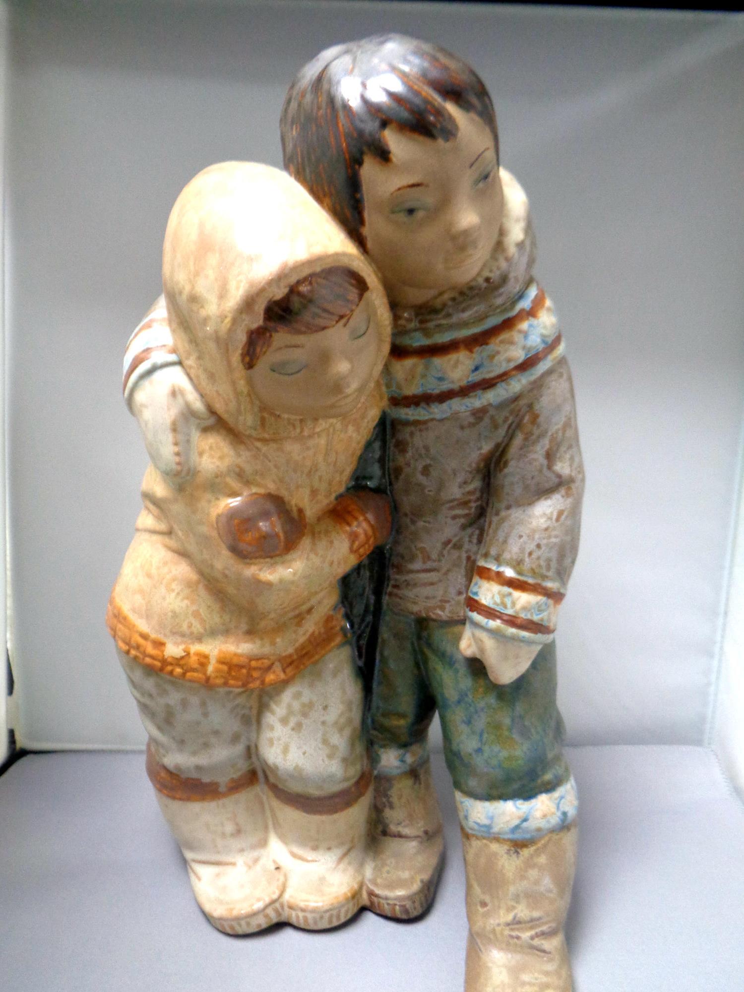 A Lladro figure - Eskimo couple,