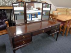 A Stag Minstrel dressing table with triple mirror