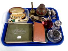 A tray containing miscellaneous to include baby rattles, a painted Spelter figure of a Spaniel,