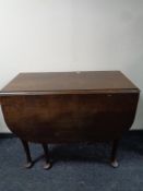 An oak gateleg table