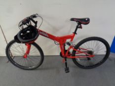 A Cross CXF 300 folding full suspension mountain bike with cycle helmet and gloves