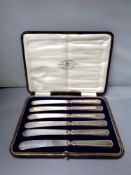 A set of six silver handled butter knives,