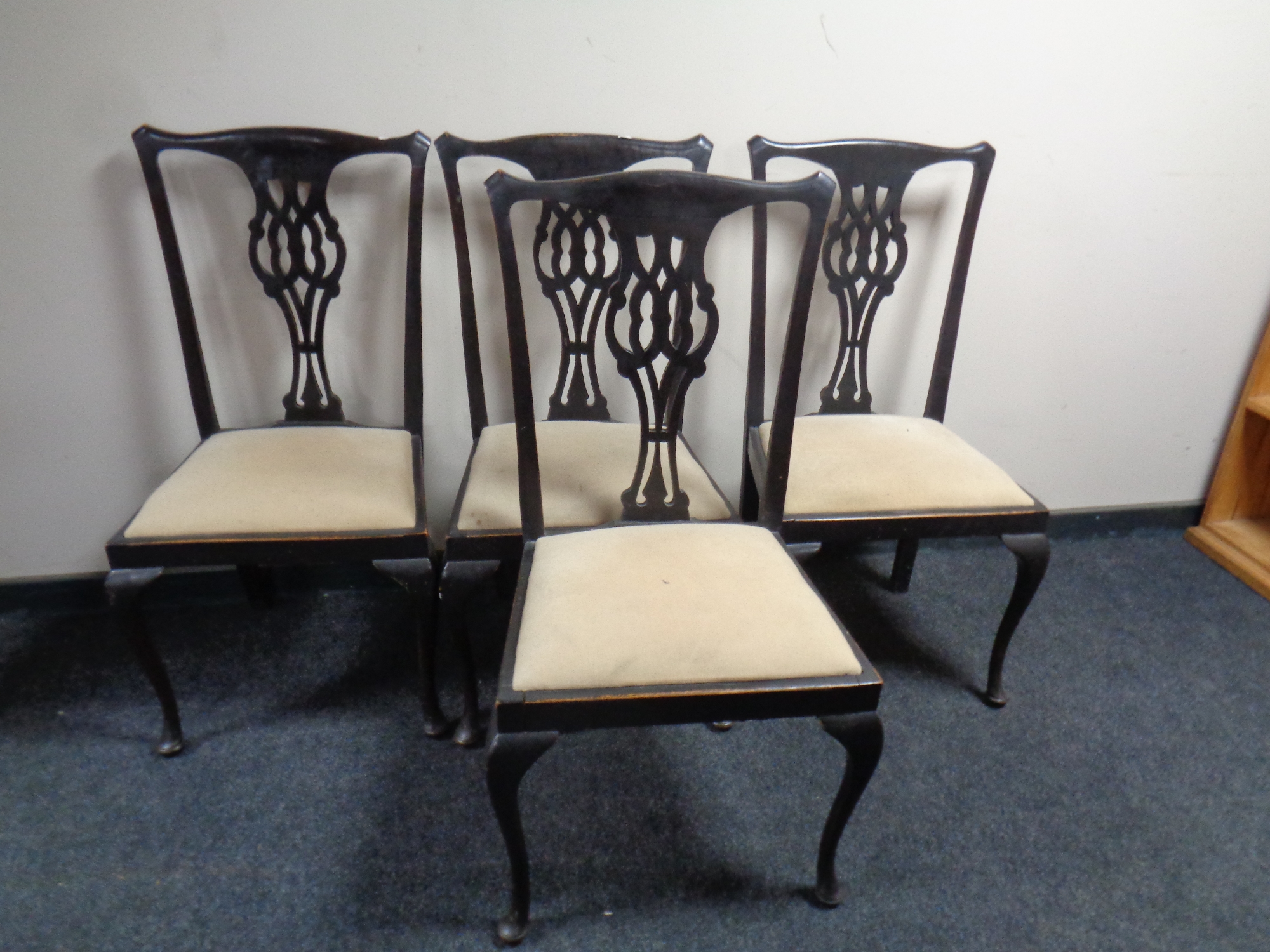 A set of four antique Chippendale style dining chairs on cabriole legs