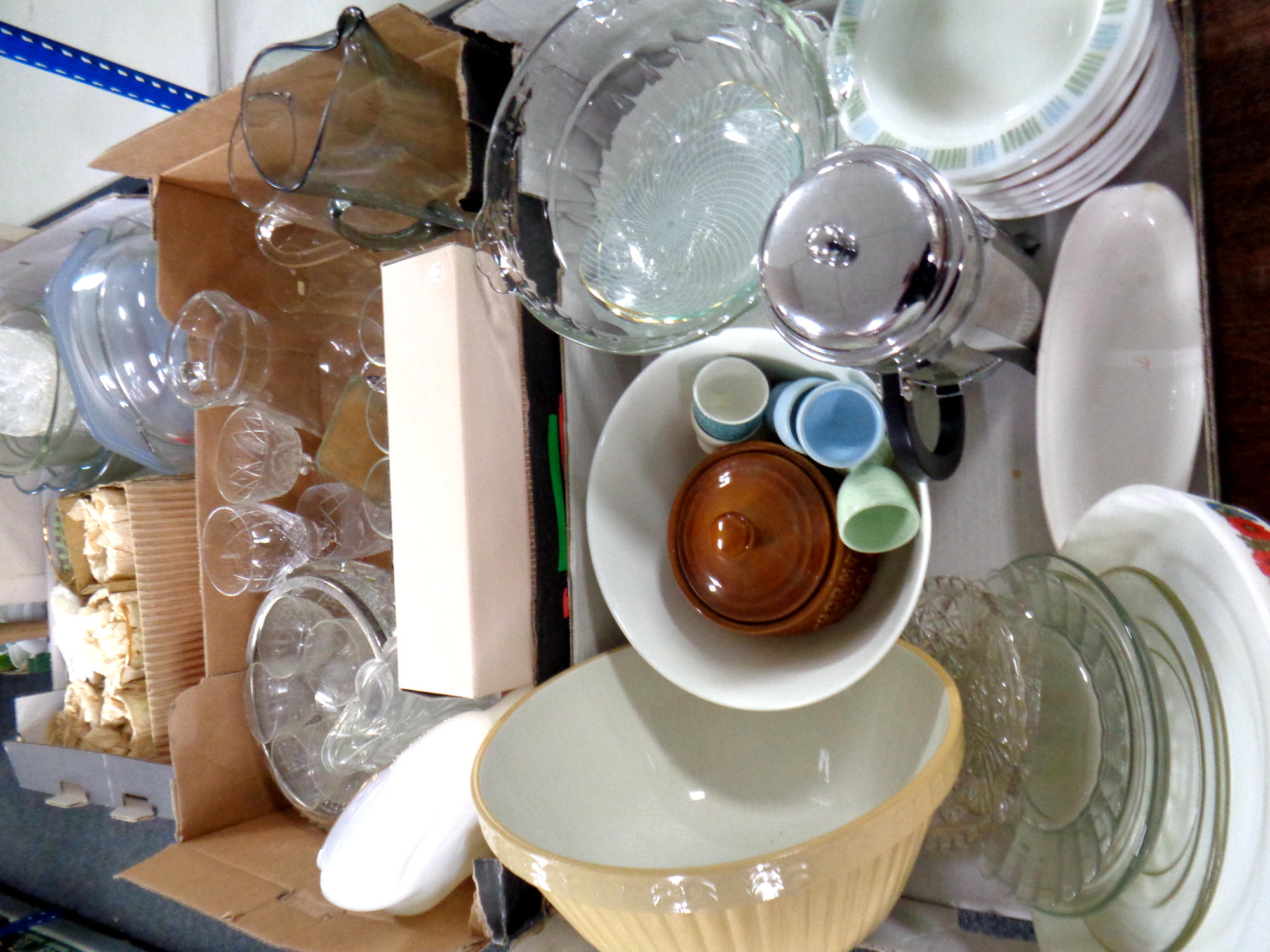 Three boxes containing assorted glass and kitchenware to include mixing bowls, egg cups, cafetiere,