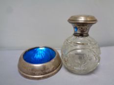 A 20th century cut glass silver topped perfume bottle bearing Birmingham hall marks,