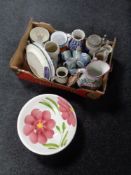 A box containing German beersteins, wash jug and basin,