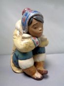 A Lladro figure - pensive Eskimo,