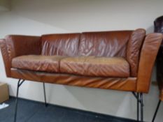 A Barker and Stonehouse brown leather settee