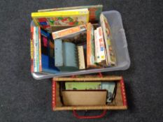 A box of 20th century jigsaws, annuals, Codeg tin plate till,