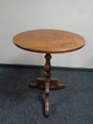 A Victorian circular pedestal tilt top occasional table