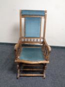 An Edwardian beech American style rocking chair