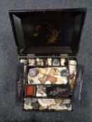 A Japanese lacquered table chest containing a large quantity of assorted gem stones and fossils