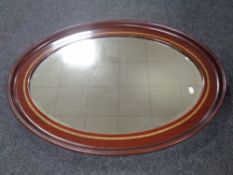 An Edwardian oval framed mirror
