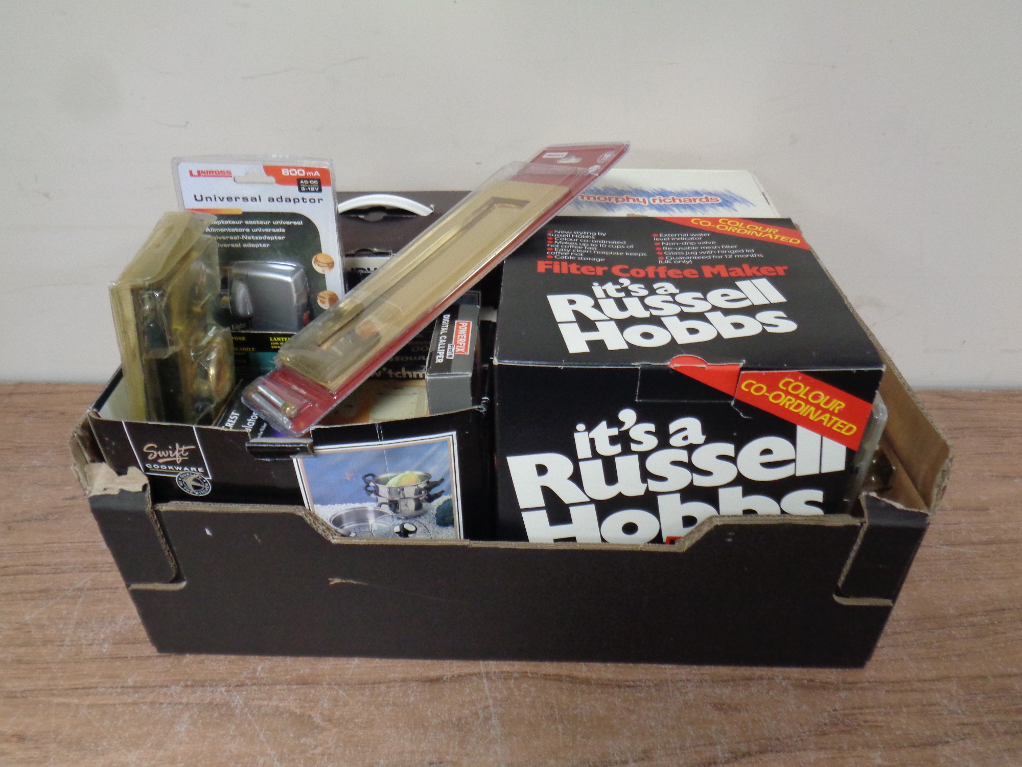 A box containing assorted electricals to include Russell Hobbs coffee maker,