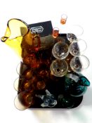 A tray of 20th century glass ware to include amber glass water jug and beakers,